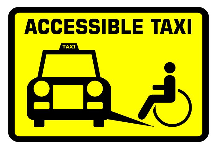 A yellow sign with accessible taxi at the top. Picture depicts taxi with a ramp, with a wheelchair user going up the ramp.